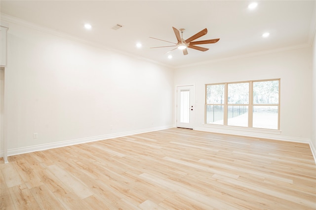 spare room featuring ceiling fan, ornamental molding, and light hardwood / wood-style floors