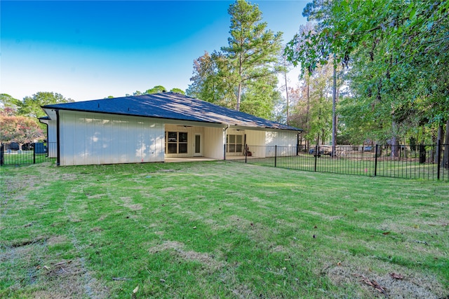 back of house with a yard