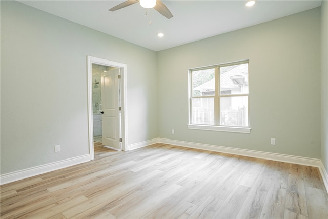 spare room featuring ceiling fan and light wood-type flooring