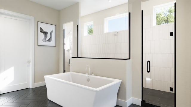 bathroom featuring plus walk in shower and parquet flooring