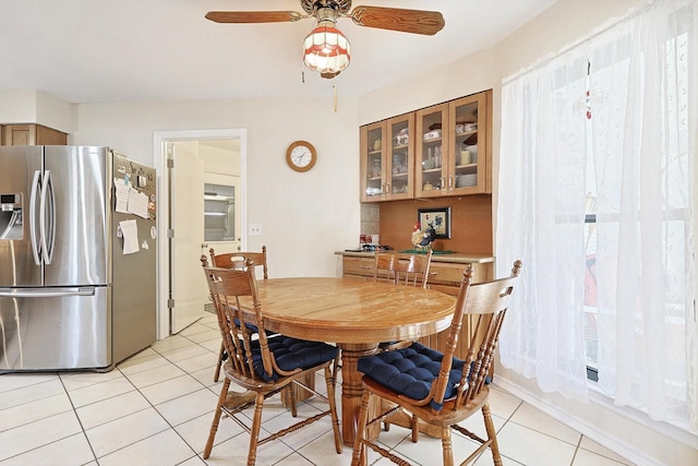 dining area featuring light tile patterned flooring and ceiling fan