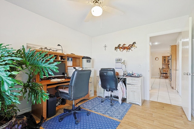 office space featuring ceiling fan and light hardwood / wood-style flooring