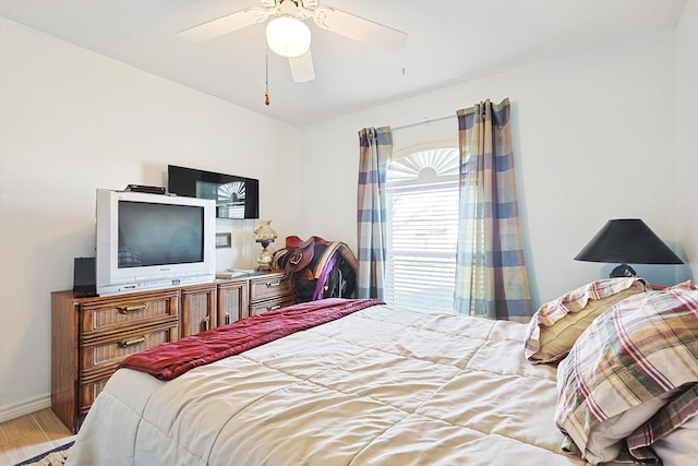 bedroom featuring light wood-type flooring and ceiling fan