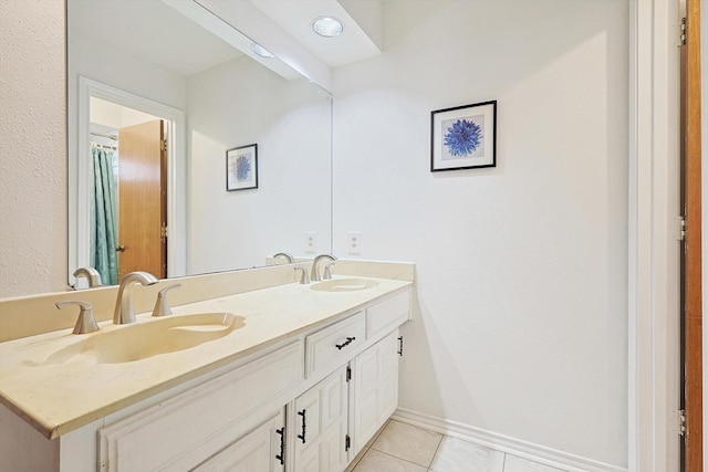 bathroom featuring tile patterned floors and vanity