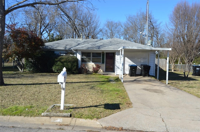 single story home featuring a front yard and a garage