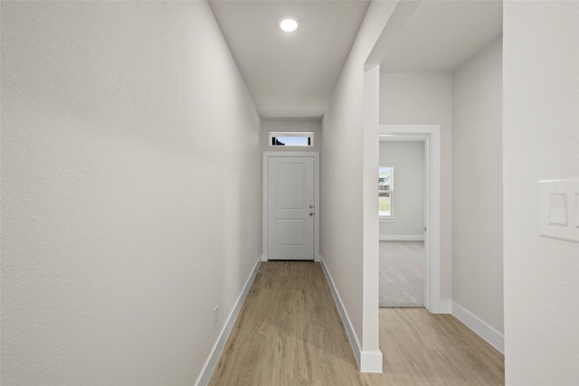 corridor featuring light hardwood / wood-style flooring