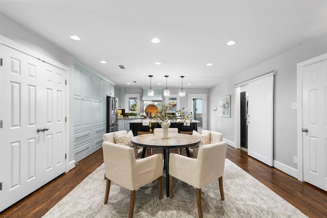 dining space with dark wood-type flooring