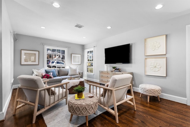 living room featuring dark wood-type flooring