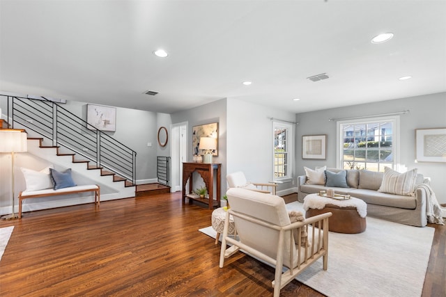 living room with dark hardwood / wood-style flooring