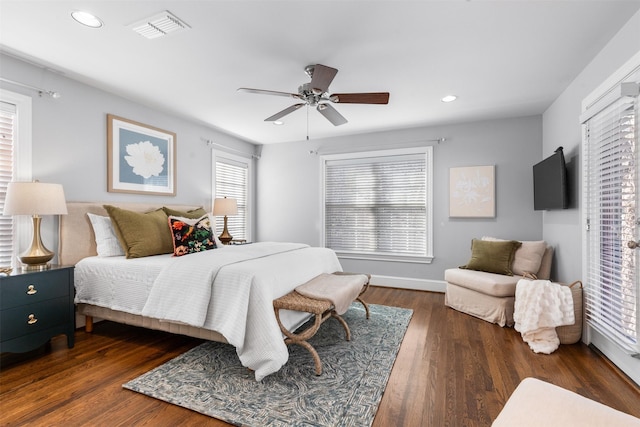 bedroom featuring ceiling fan and dark hardwood / wood-style flooring