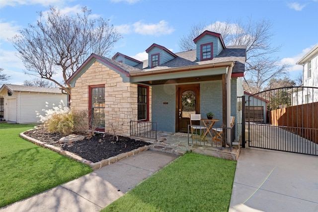 view of front of house with covered porch and a front lawn