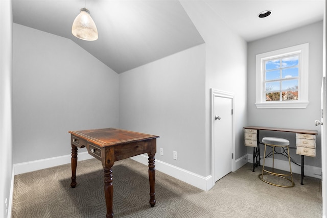 carpeted office space featuring lofted ceiling