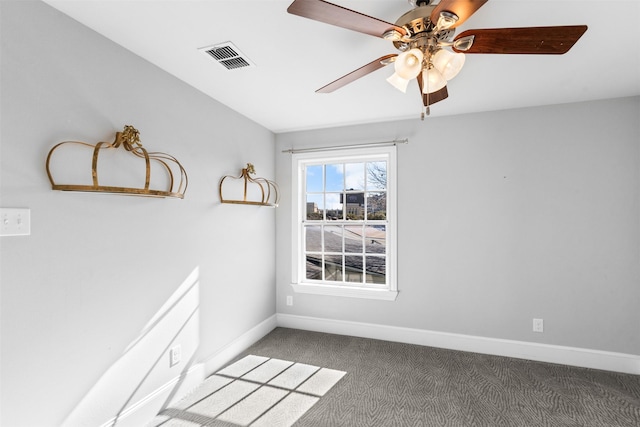 carpeted empty room featuring ceiling fan