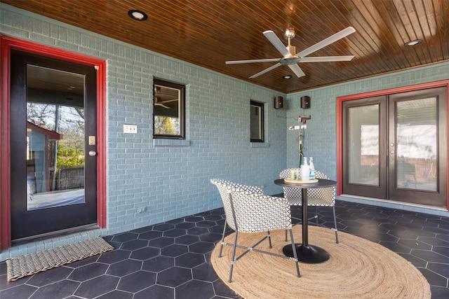 view of patio / terrace featuring french doors and ceiling fan