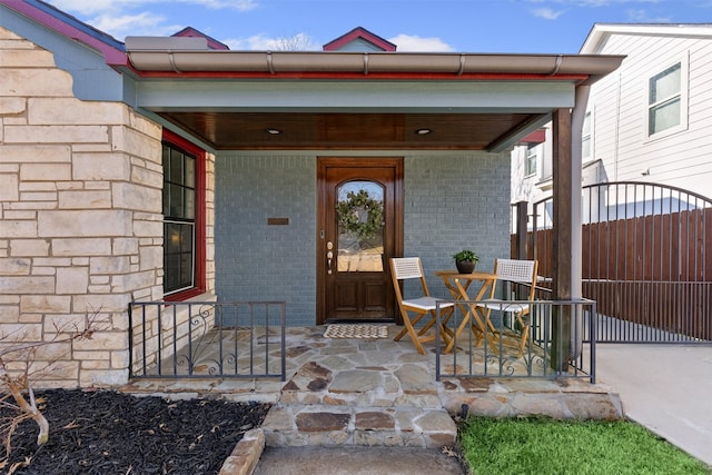 view of front of home featuring a porch and a garage