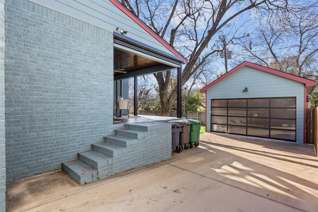 view of property exterior with a garage and an outdoor structure