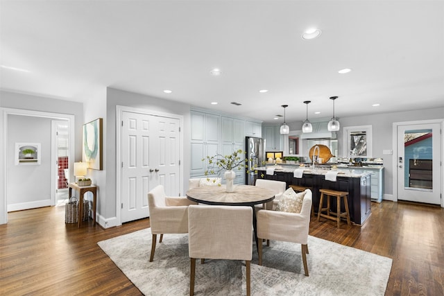 dining area featuring dark hardwood / wood-style floors