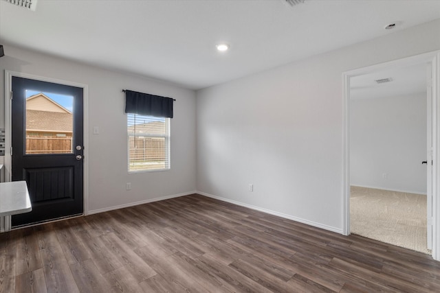 entrance foyer with dark hardwood / wood-style floors