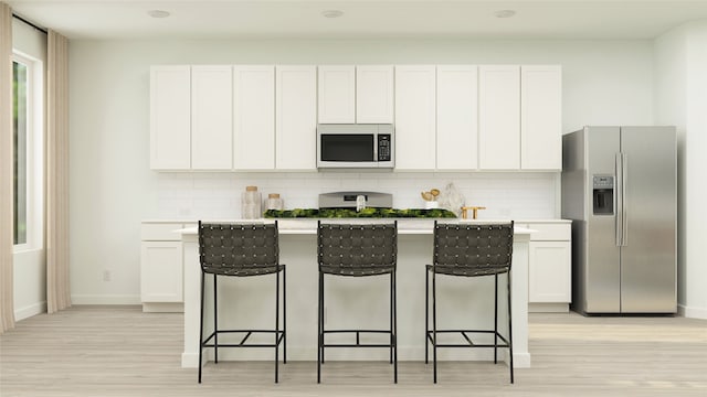 kitchen with white cabinets, stainless steel fridge with ice dispenser, backsplash, and light hardwood / wood-style flooring