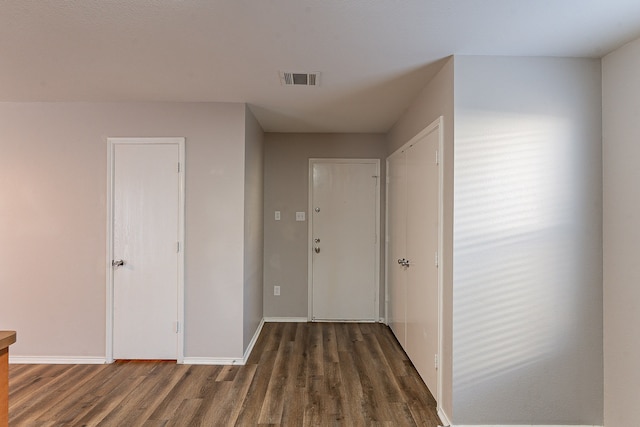 hall featuring dark wood-type flooring