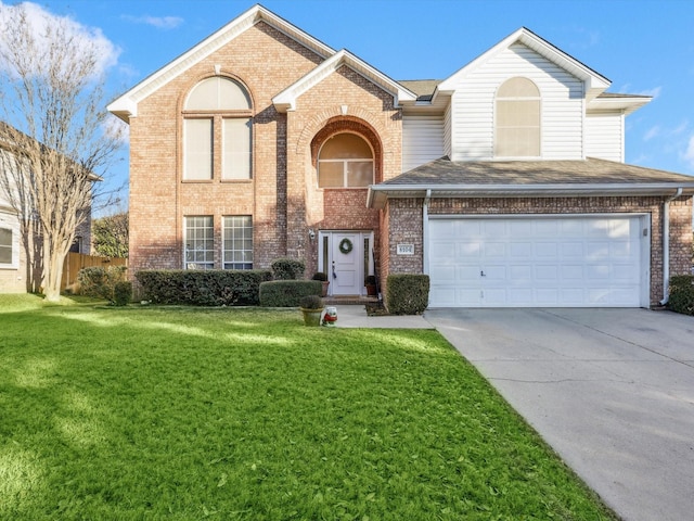 view of front property with a front yard and a garage