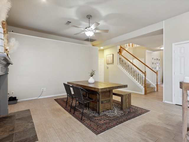 dining area featuring ceiling fan and light hardwood / wood-style floors