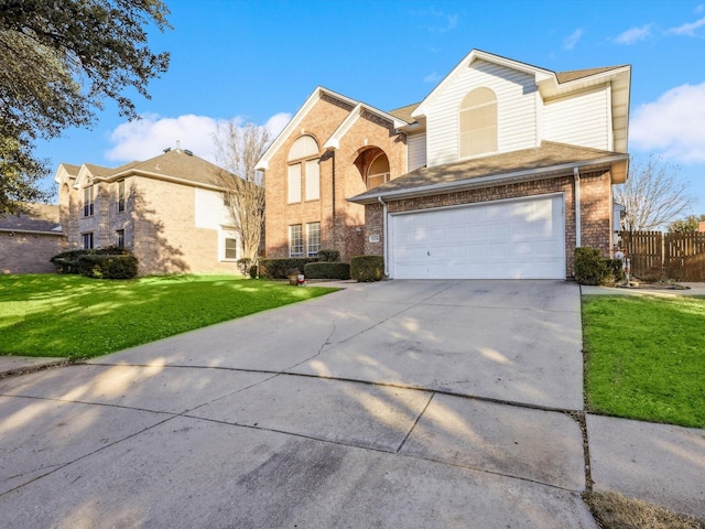 front of property featuring a garage and a front lawn