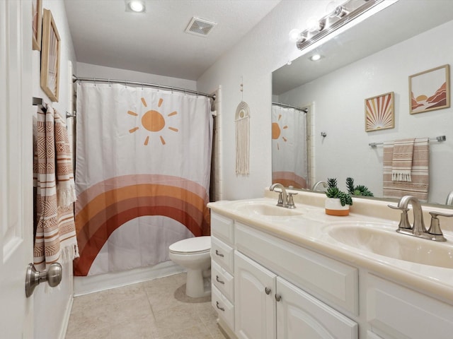 full bathroom featuring vanity, shower / bath combo, and toilet