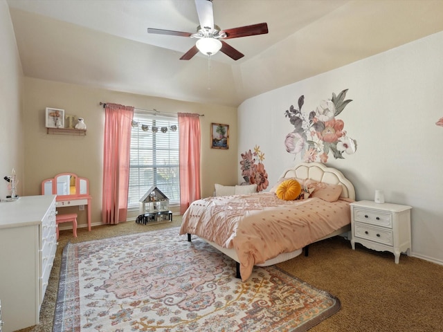 carpeted bedroom with ceiling fan and vaulted ceiling