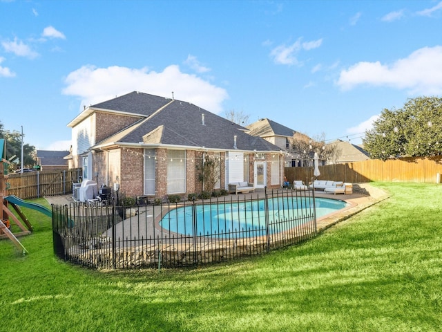 view of swimming pool with a lawn, a patio area, and an outdoor hangout area