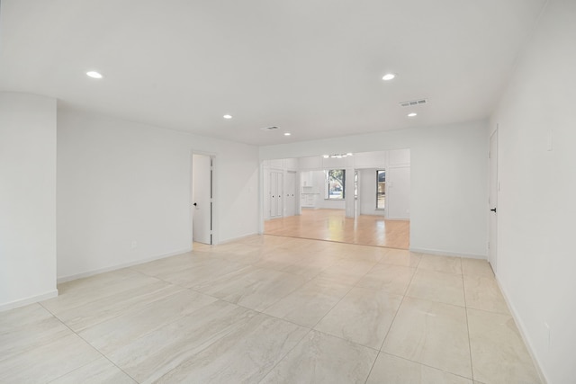 empty room with light tile patterned flooring