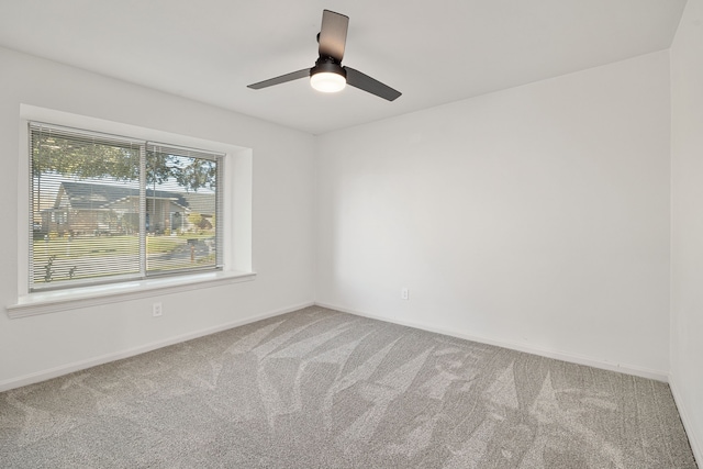 spare room with ceiling fan and carpet floors