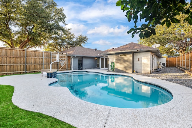 view of swimming pool with a patio area