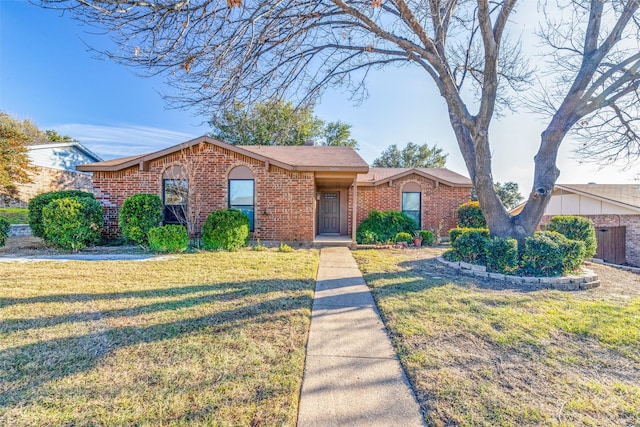 single story home featuring a front yard