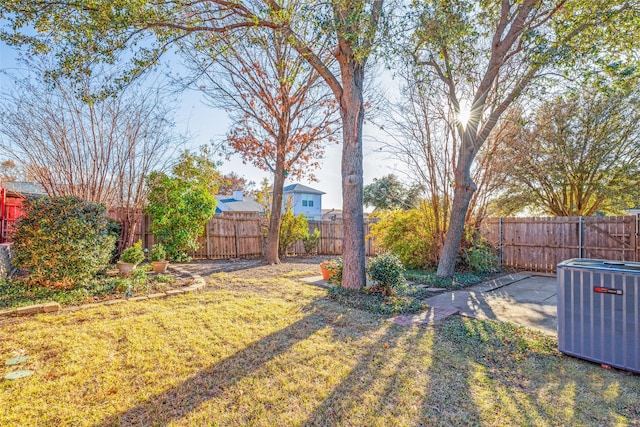 view of yard with central AC unit