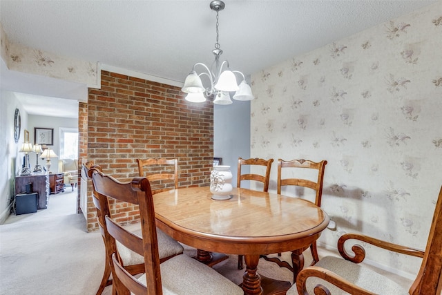 carpeted dining space with a chandelier