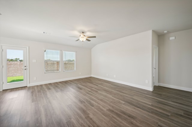 spare room featuring dark hardwood / wood-style flooring and ceiling fan