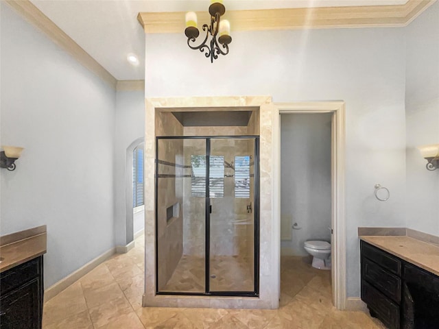 bathroom with toilet, vanity, a chandelier, and crown molding