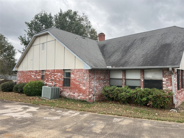 view of property exterior with central AC unit