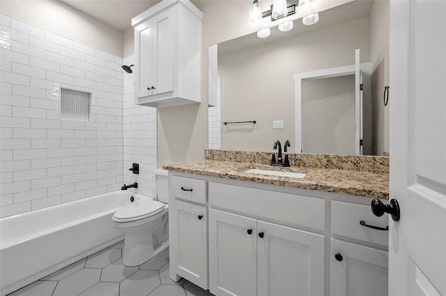 bathroom with toilet, washtub / shower combination, tile patterned flooring, and vanity
