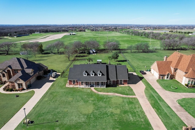 birds eye view of property featuring a rural view