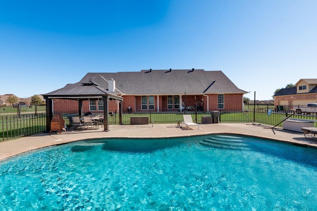 view of swimming pool with a patio, a gazebo, fence, and a fenced in pool