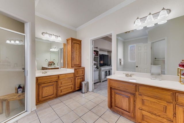 bathroom with tile patterned floors, vanity, and ornamental molding