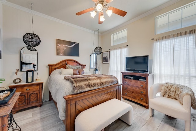 bedroom with light wood-type flooring, ceiling fan, and ornamental molding