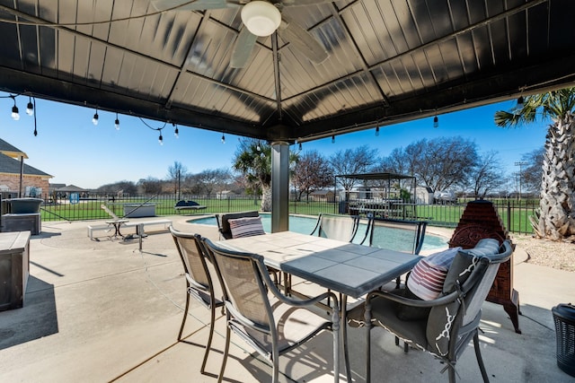 view of patio / terrace featuring a gazebo and a fenced in pool