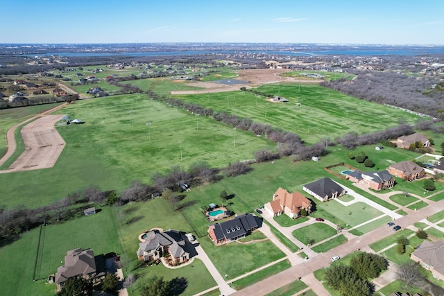 birds eye view of property with a rural view