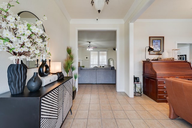 tiled foyer featuring ceiling fan and ornamental molding