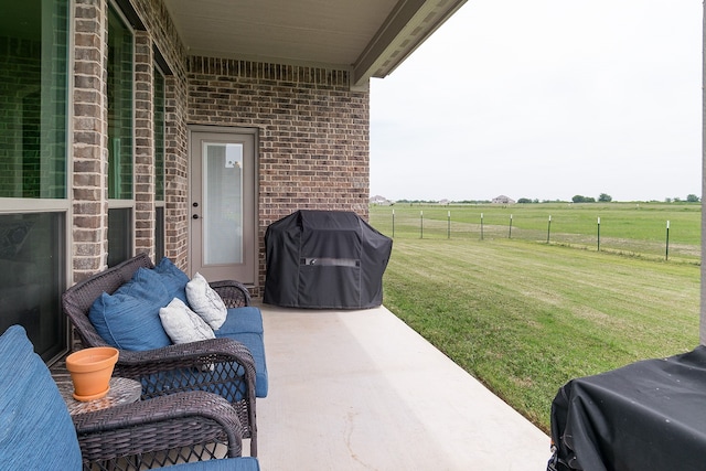 view of patio / terrace with a rural view and grilling area