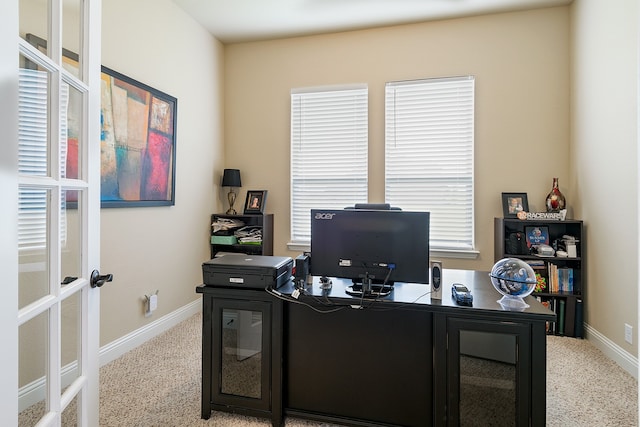 office space with light colored carpet and french doors