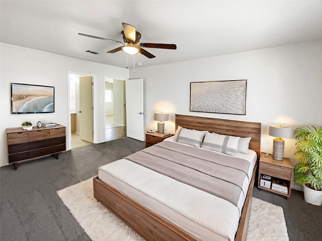 bedroom featuring ensuite bath and ceiling fan